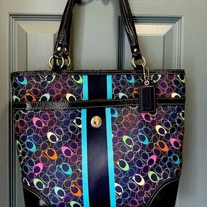 Navy Coach shoulder bag with multi-color C’s. Accompanying cosmetics case.